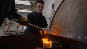 Students casting metal and working in the Metals Studio.