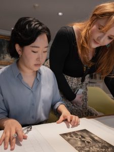 Art History MFA students Liz Chung and Jenah Creecy cateloging a Raymond Meeks acquisition in the Virginia Museum of Fine Arts Library.