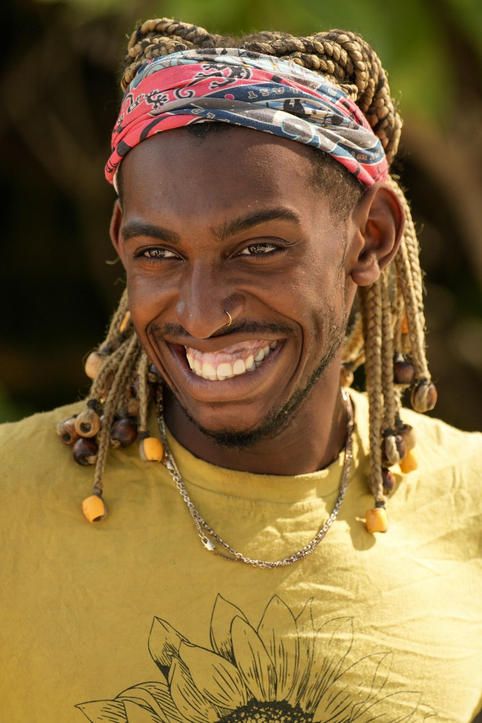 A photo of a man from the chest up. He is similing. 