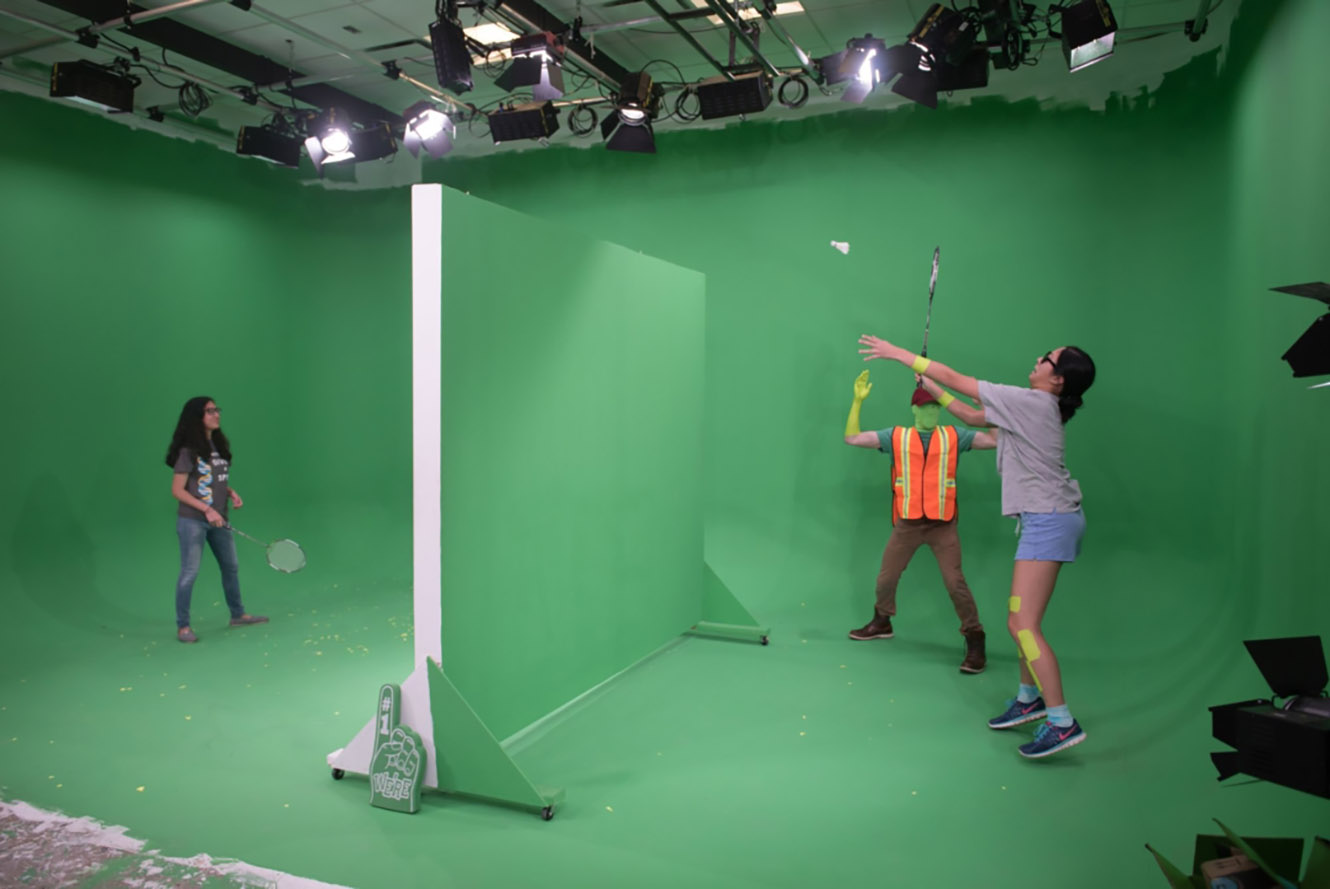 students in green screen studio for filming project