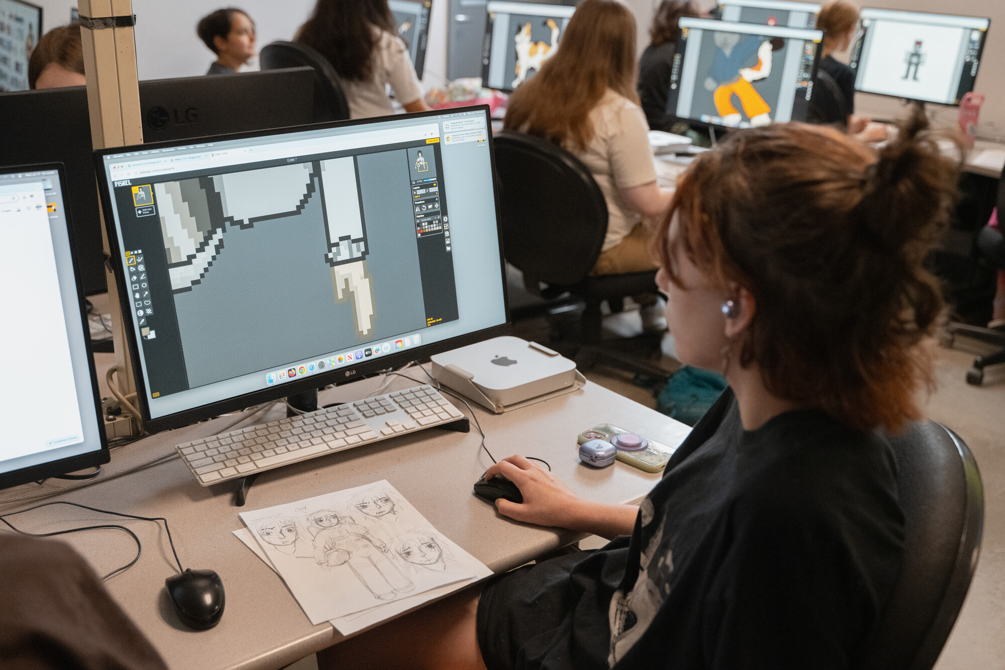 Art Education students instructing K-12 grade children during the summer Creative Arts Camp held in the DePillars Building.