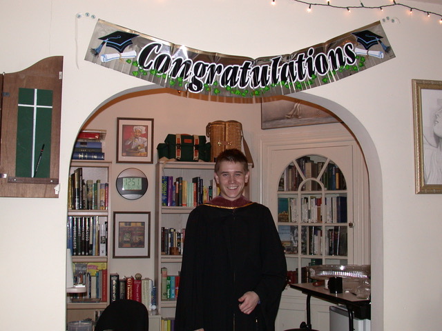 man graduation cap and gown