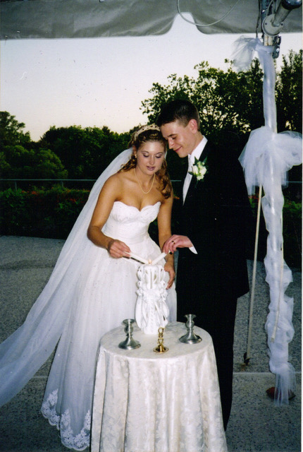 bride and groom cutting cake