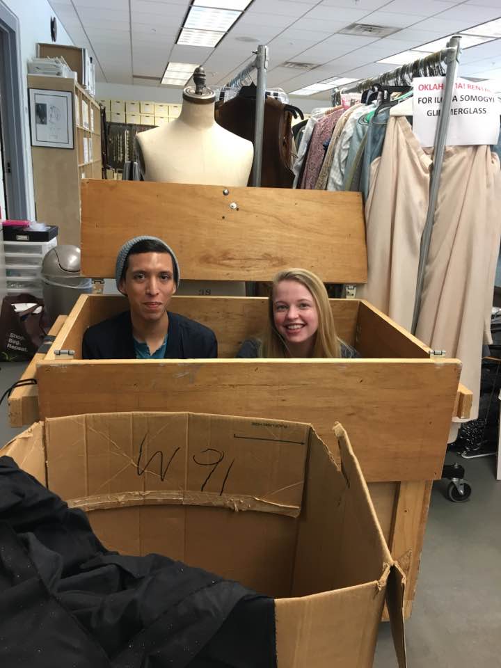 two people in a cardboard box