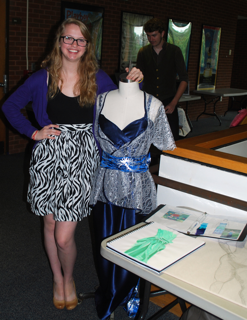 woman standing next to a mannequin