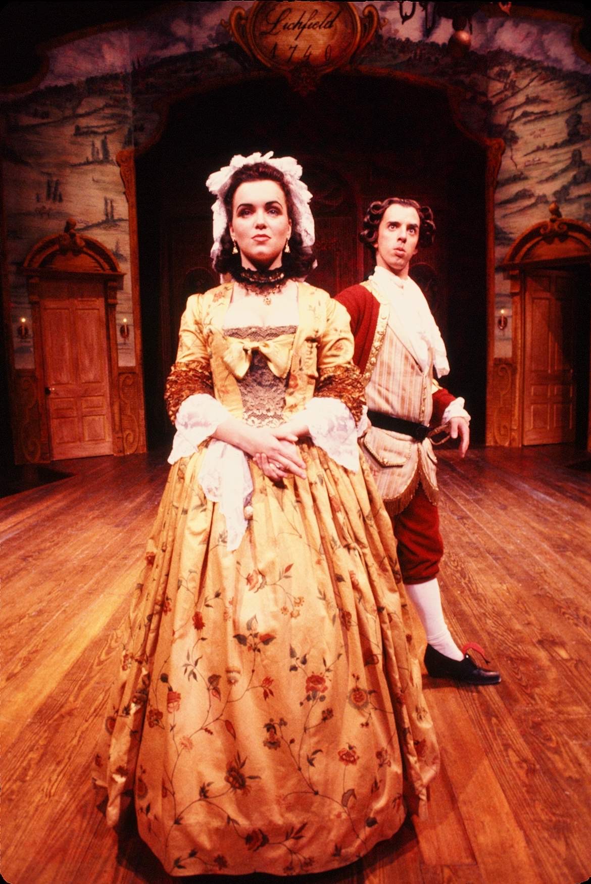woman on stage in period costume