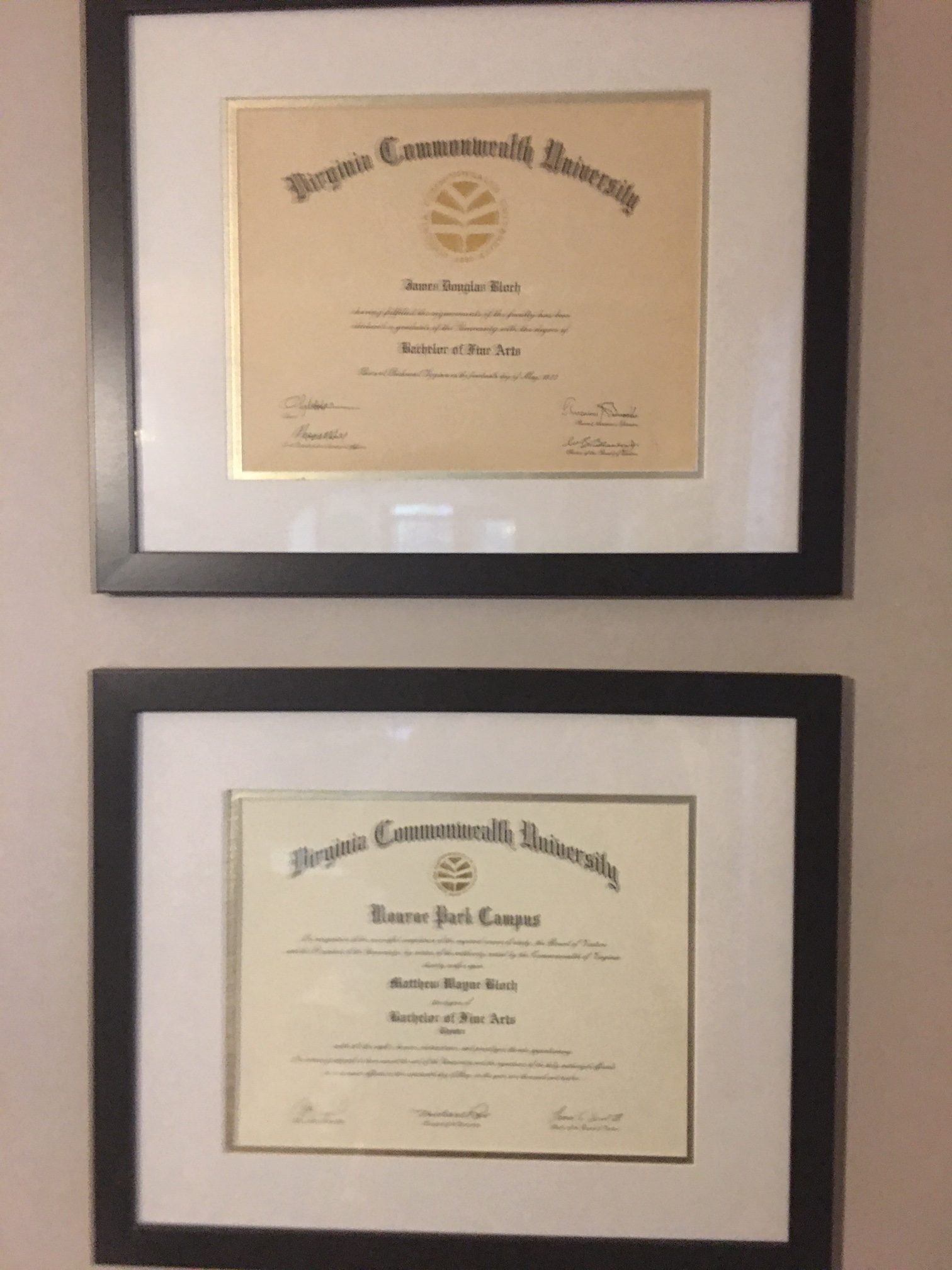 two framed diplomas