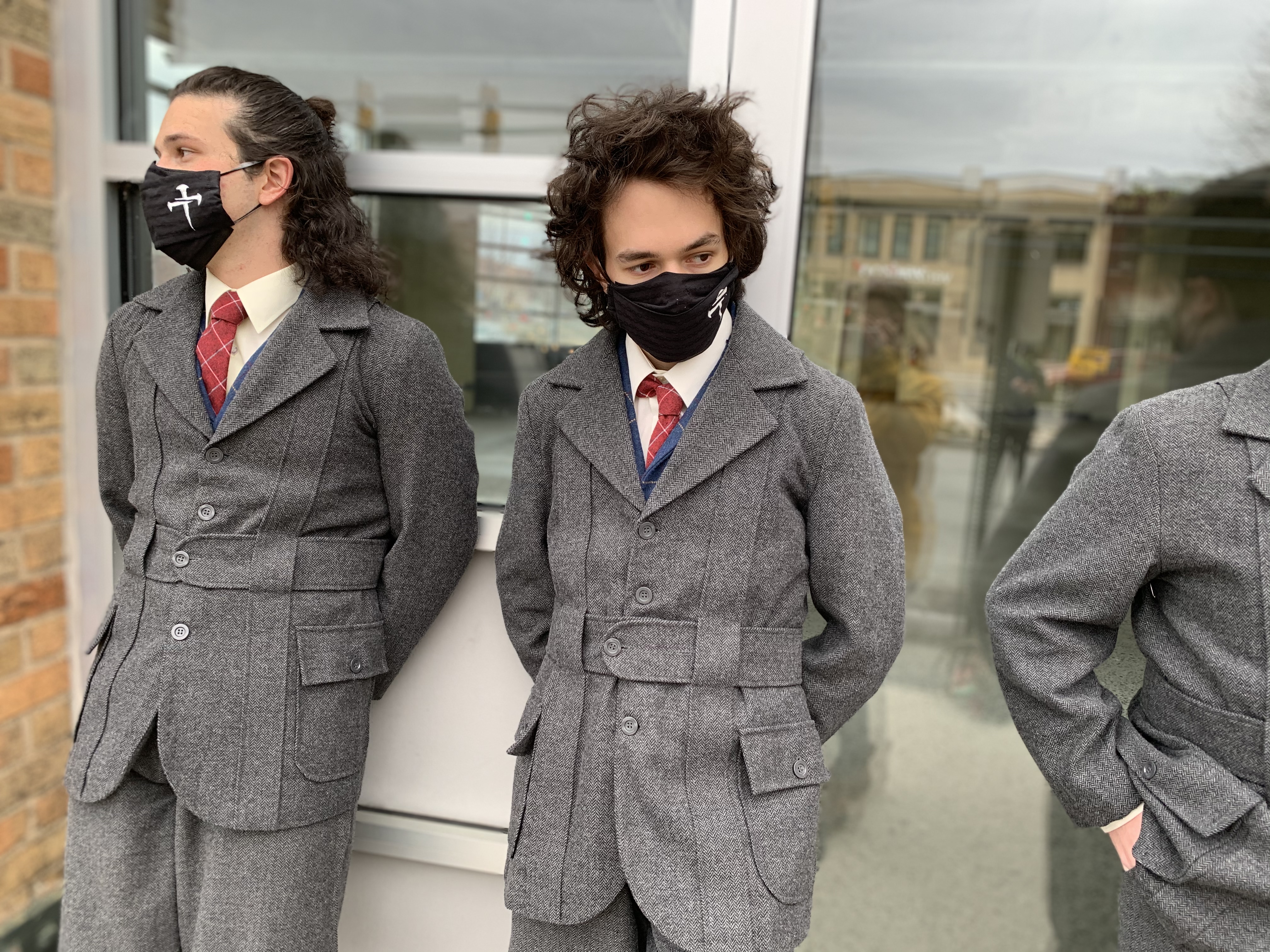 three people in school uniforms