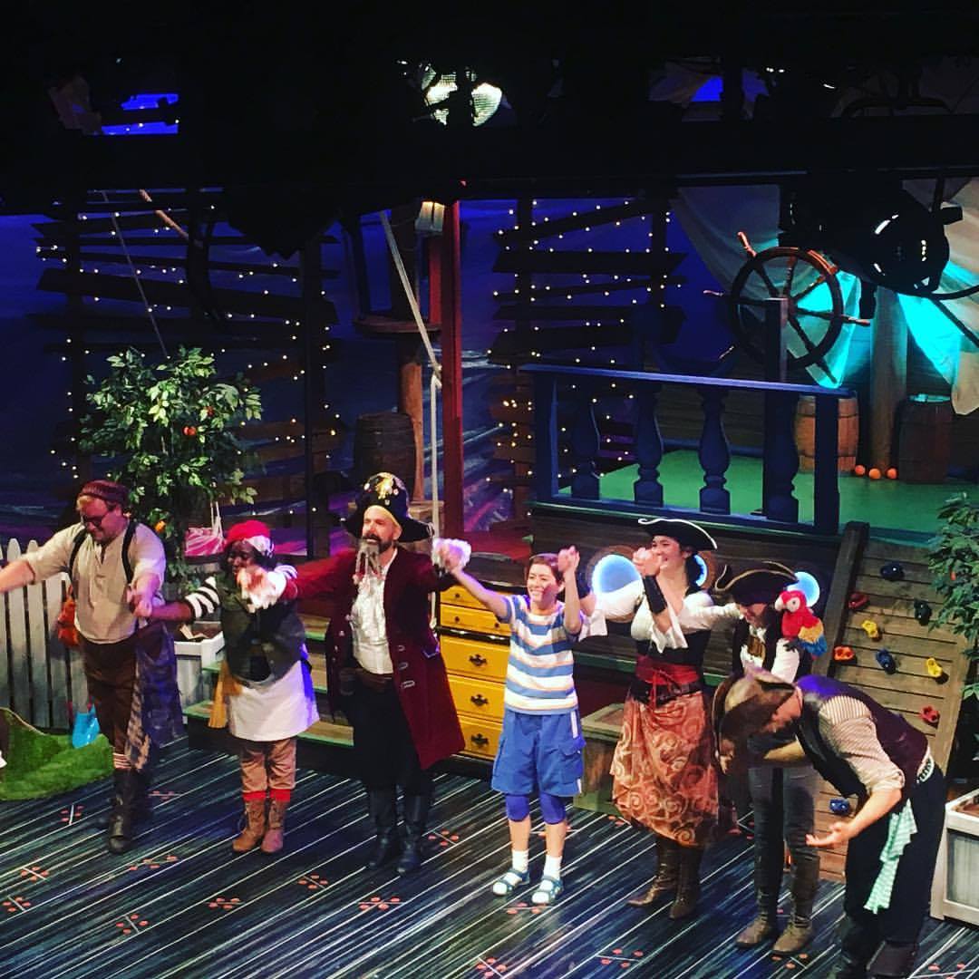 actors in costume bowing on stage