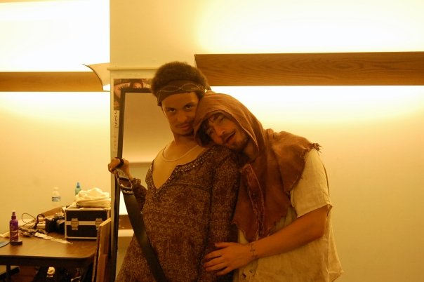 two men hugging in costume