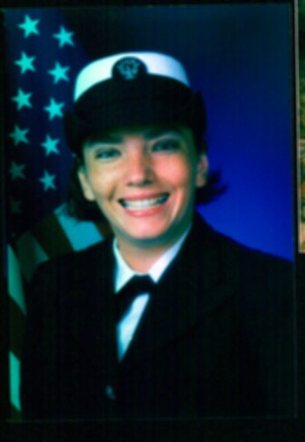 woman smiling in u s navy uniform