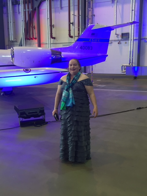 woman in dress beside plane