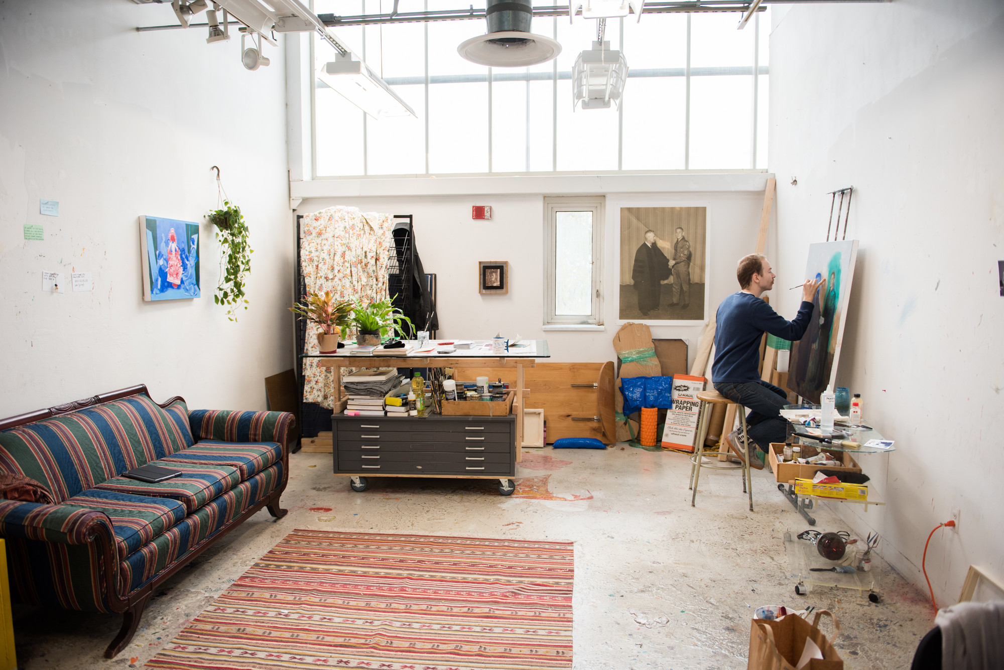 example of a graduate studio space with student working in studio