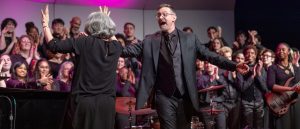 music professor leading chorus performance