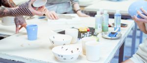 students making pottery in craft studio