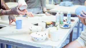 students making pottery in craft studio