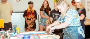 v c u faculty demonstrating screen printing in the classroom