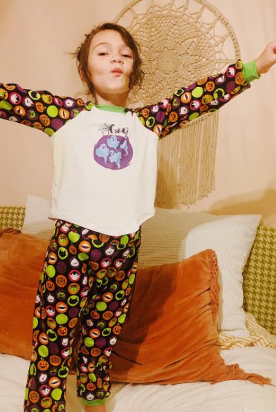 kid in halloween pajamas