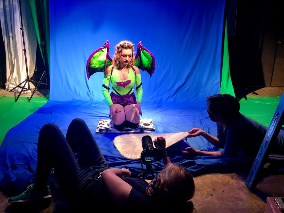 actor in costume in front of blue screen