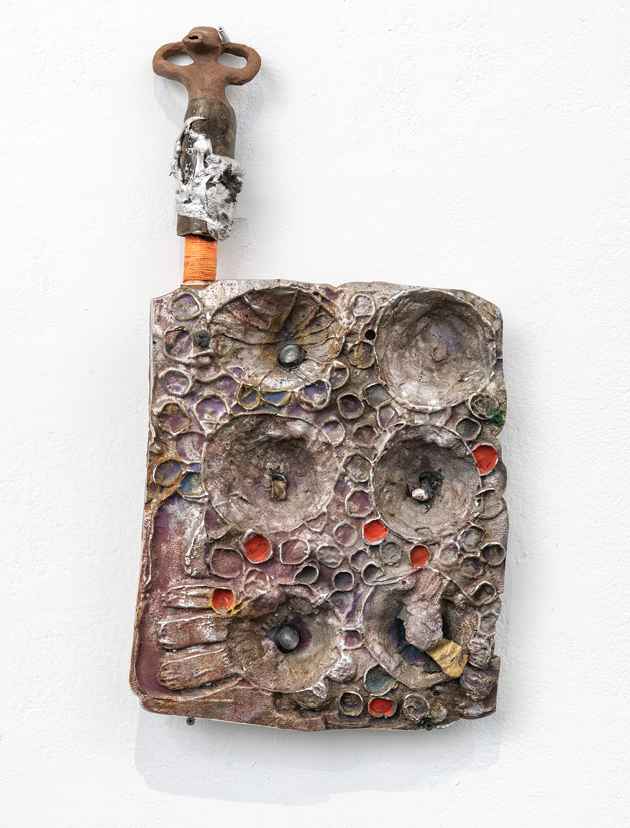 Detailed view of In-Habi-ted (ii), Aluminium, ceramic, peepholes, string, earpod, 19