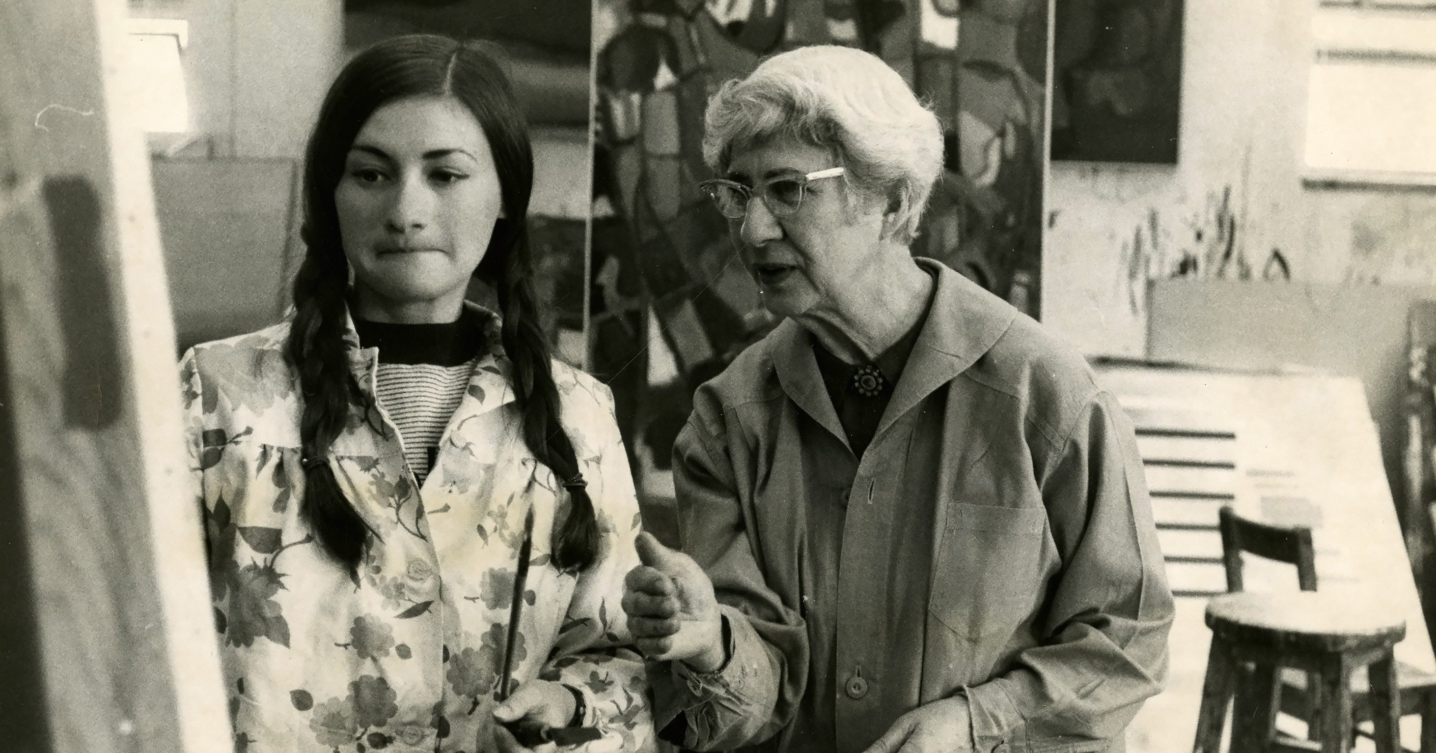 Archival photo of Theresa Pollak with a student