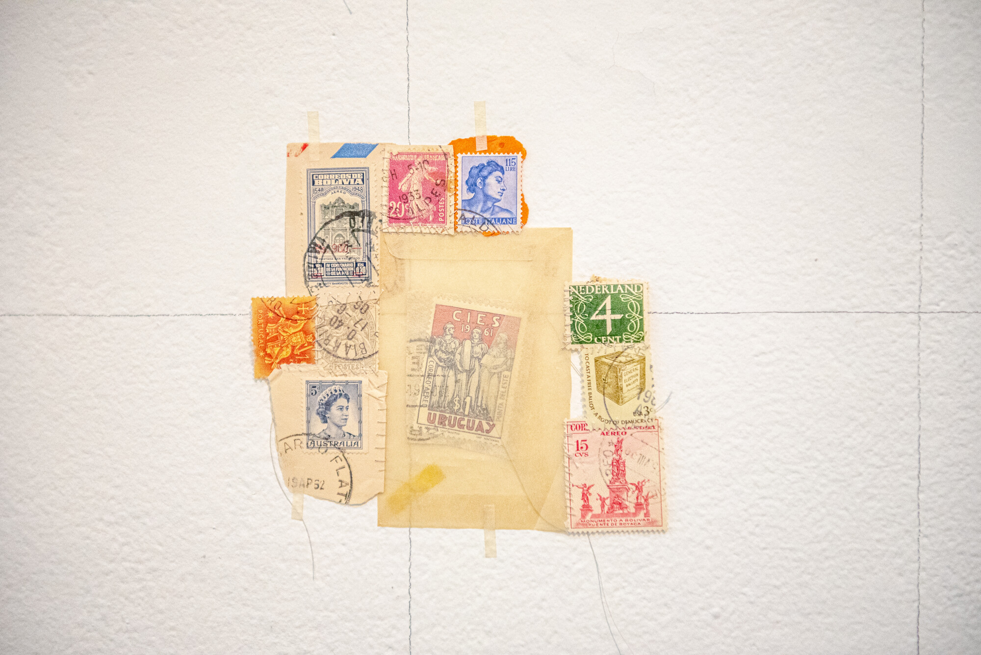 This is a map; a memory. Used stamps are woven into double-cloth pockets, embroidered, and stitched together, to think about all stamps ever sent and messages received across impossible distances.