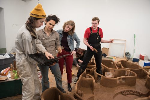 Art history students installing a gallery show at the anderson