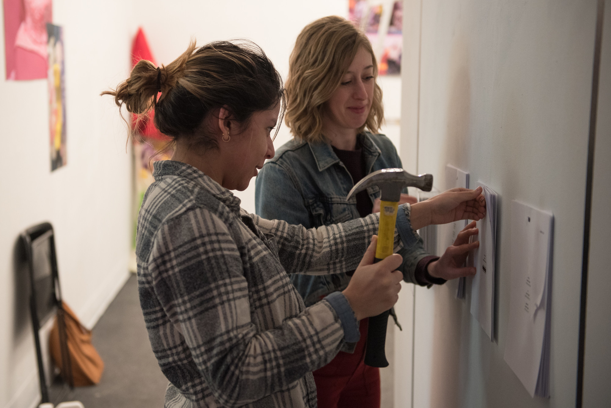 Art history students installing a gallery show at the anderson