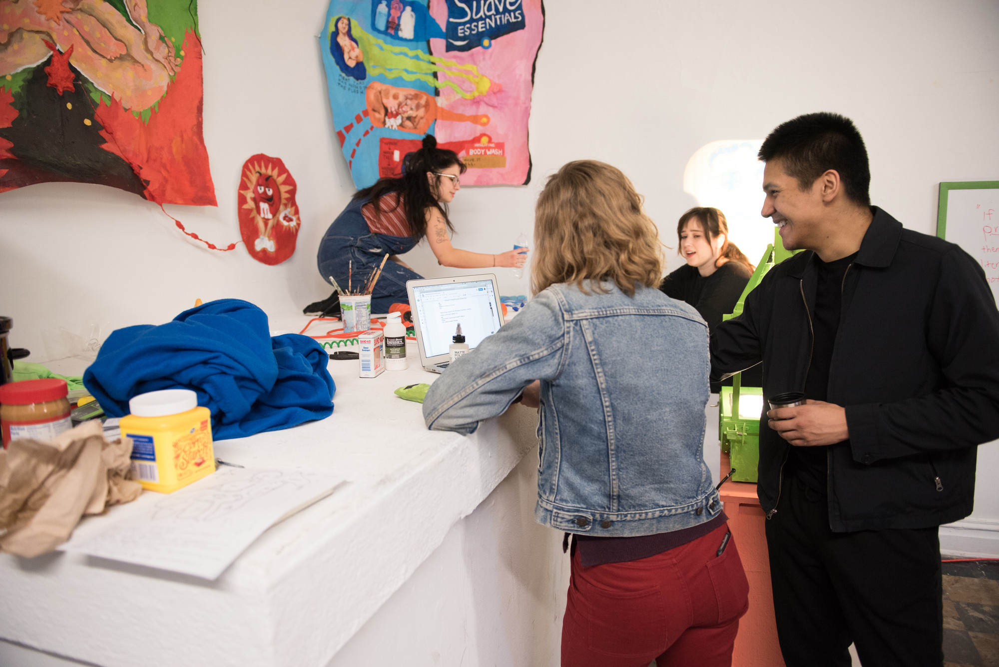 Art history students installing a gallery show at the anderson