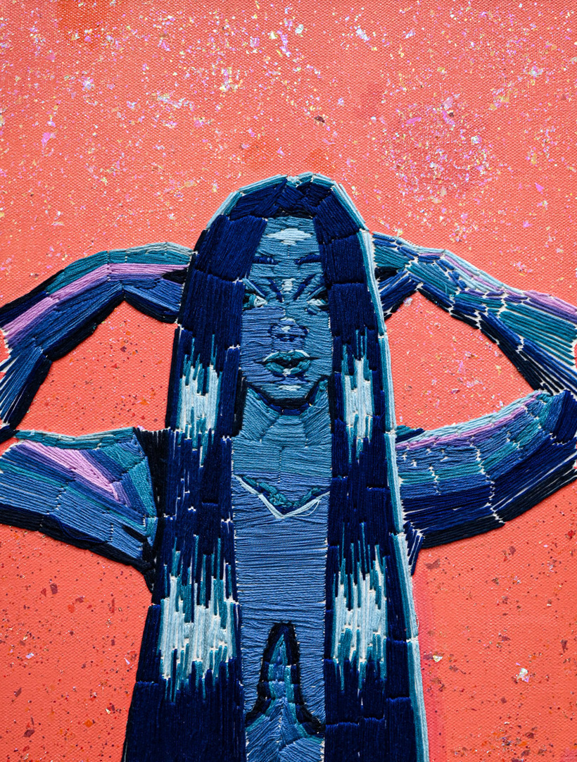 Portrait of a figure with long hair holding their hands behind thier head against a pink background made with stitching and thread in shades of blue