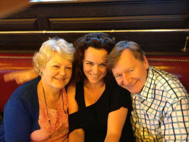 three people smiling