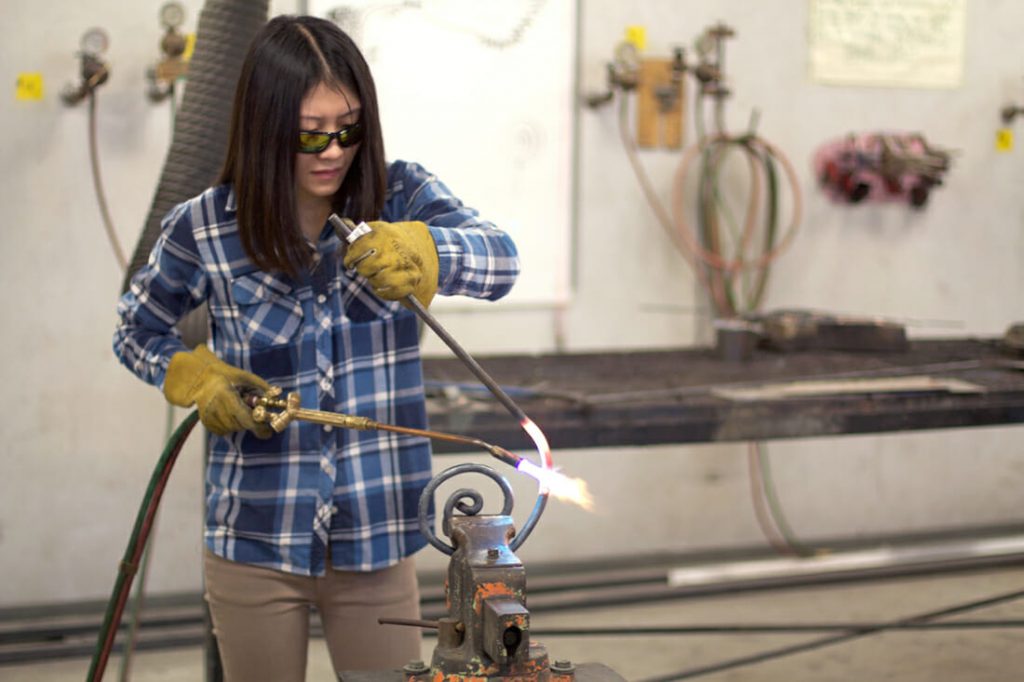 student working in metal shop 