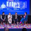 Panelists on stage during Tasmeem Doha event