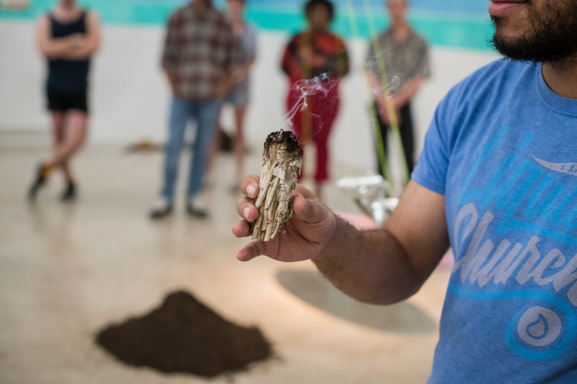 Detail of Francheska Alcantara's performative work, showing a person burning sage