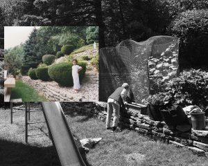 A man and a woman are caring for plants in a garden, surrounded by trees. The scene is set outdoors, possibly near a cemetery, with grave markers visible. The image has a black and white tone.