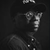 Portrait photo in black and white of artist and filmmaker, Nile Price