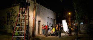 Cinema students and faculty outside the Depot and Depot Annex filming on location as part of the Cinema Program Summer Intensive film shoot.