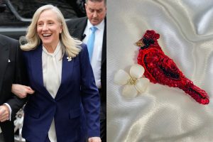 On left, virginia governor abigail spanberger in a blue suit and white shirt. on right, close up of beaded cardinal and dogwood flower pins.