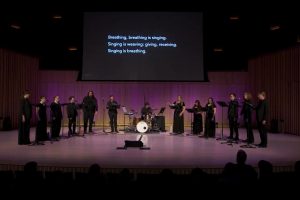Small choir performs on stage